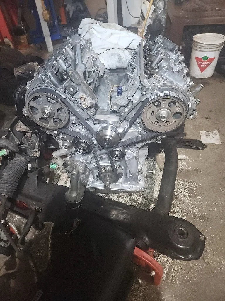 Reassembled engine and timing system on a shop stand