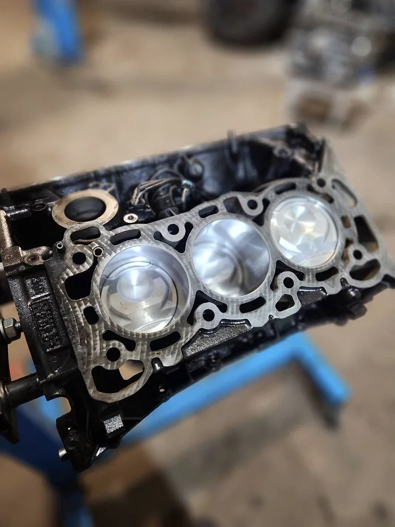 Fresh pistons installed in a prepared engine block